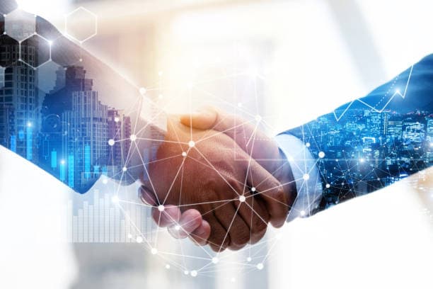 Business handshake with a digital network overlay